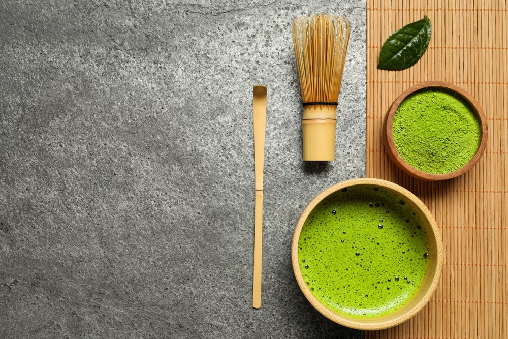 Cup of fresh matcha tea on the table