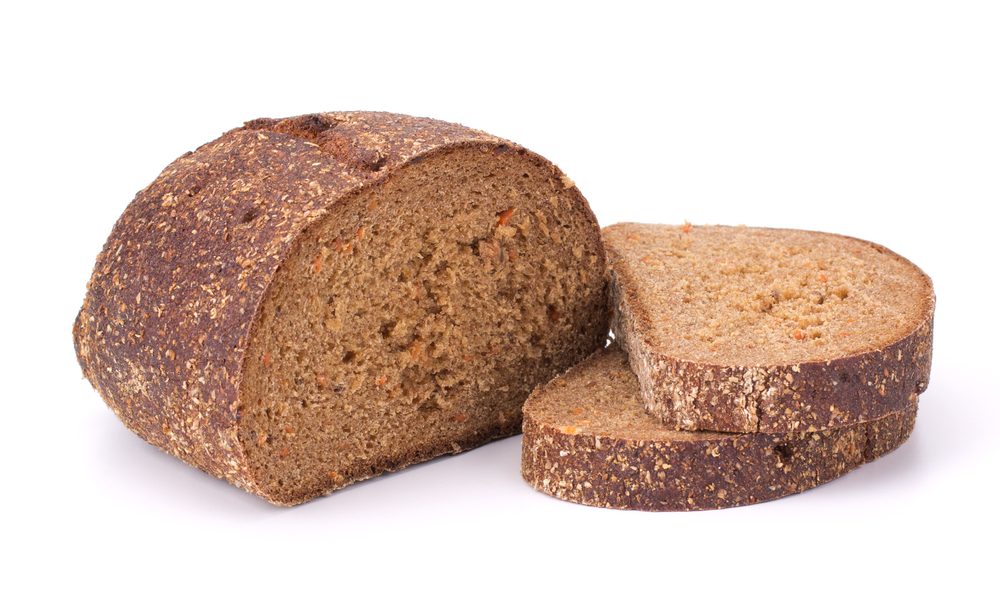 Slices of rye bread on white background